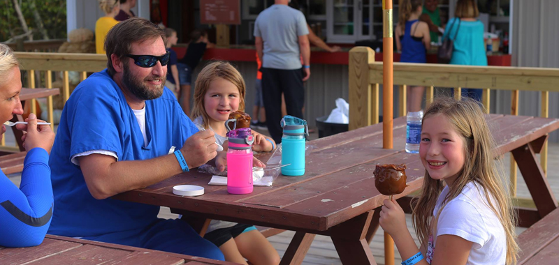 Family Eating Caramel Apples