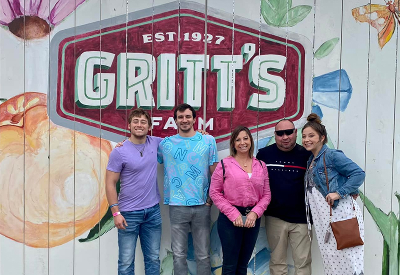 Family Photo In Front of Gritt’s Logo Family Photo In Front of Gritt's Logo